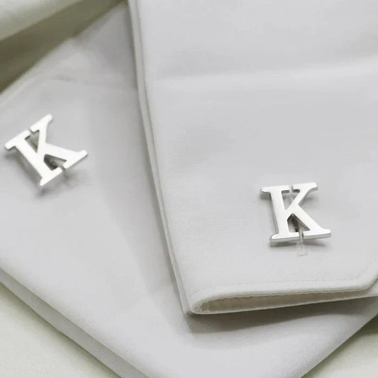 Close-up of an Eraya Jewel Silver Customized Single Initial Cufflink on a man's shirt, highlighting the elegant personalized initial detail.