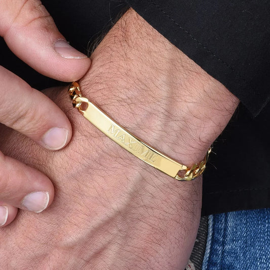 Model showcasing an Eraya Jewel Custom Engraved Men's ID Bracelet in a polished Gold finish, featuring personalized engraving on his wrist.