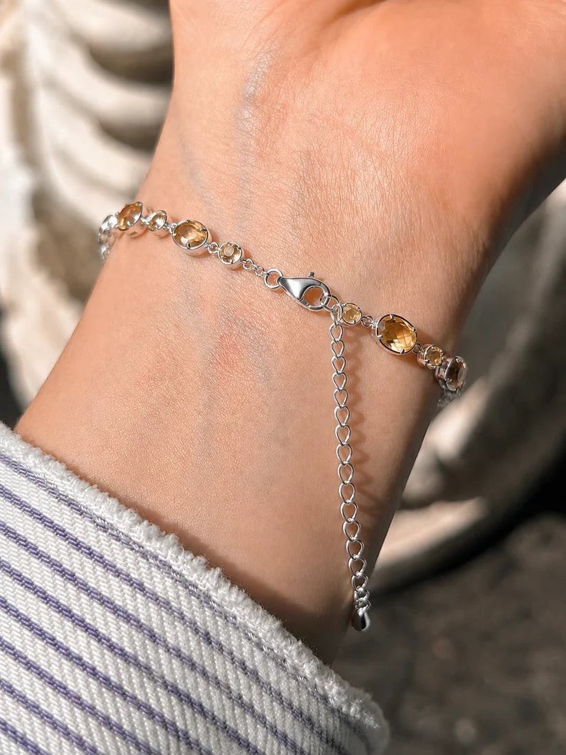 Champagne gemstone bracelet with premium silver finish, anti-tarnish coating, and adjustable design.