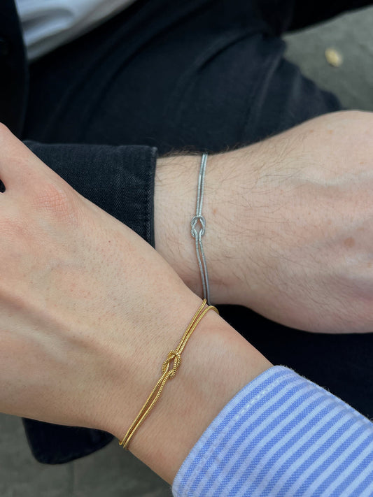 Couple wearing knot bracelets