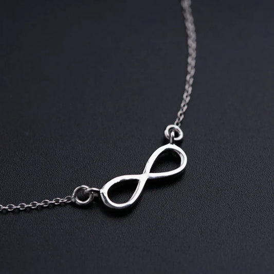 Close-up of the 925 Sterling Silver Infinity Pendant by Eraya Jewel, highlighting its high-polish finish and fine craftsmanship