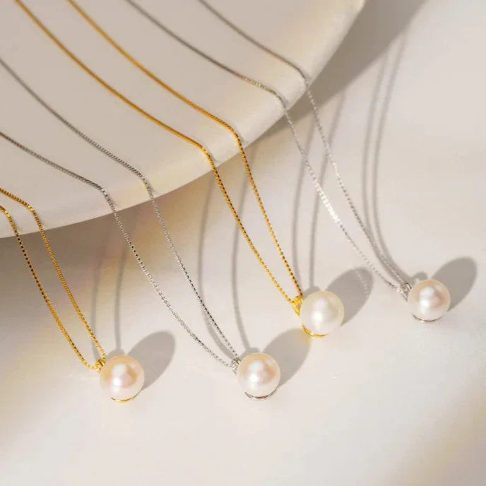 Lifestyle shot of the Minimalist Pearl Pendant displayed