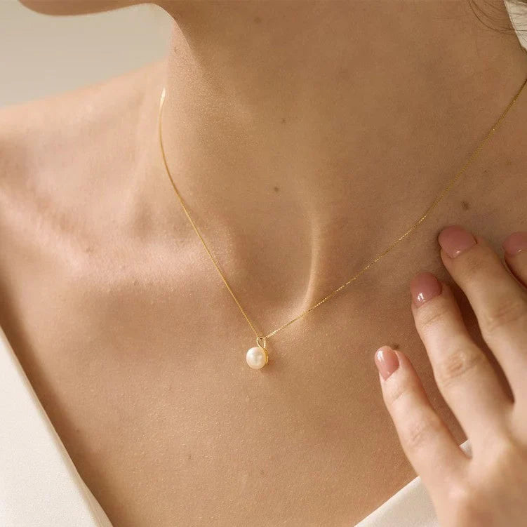 Model wearing the Minimalist Pearl Pendant, showcasing its refined 925 sterling silver design and understated elegance