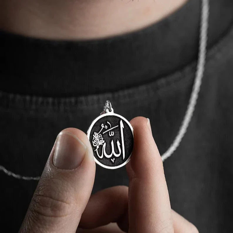 Detailed view of the engraved Arabic calligraphy on the Noor Al-Iman Pendant, reflecting expert craftsmanship