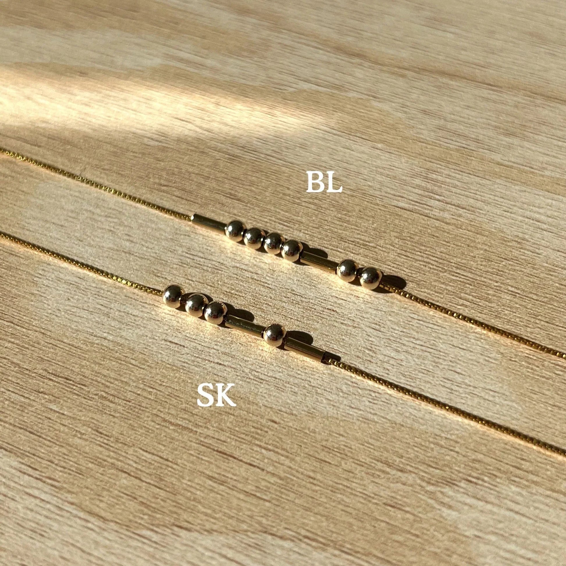 Eraya Jewel Elegant Custom Morse Code Bracelet showcasing both the gold plated and silver plated options, emphasizing the design and personalization aspect.