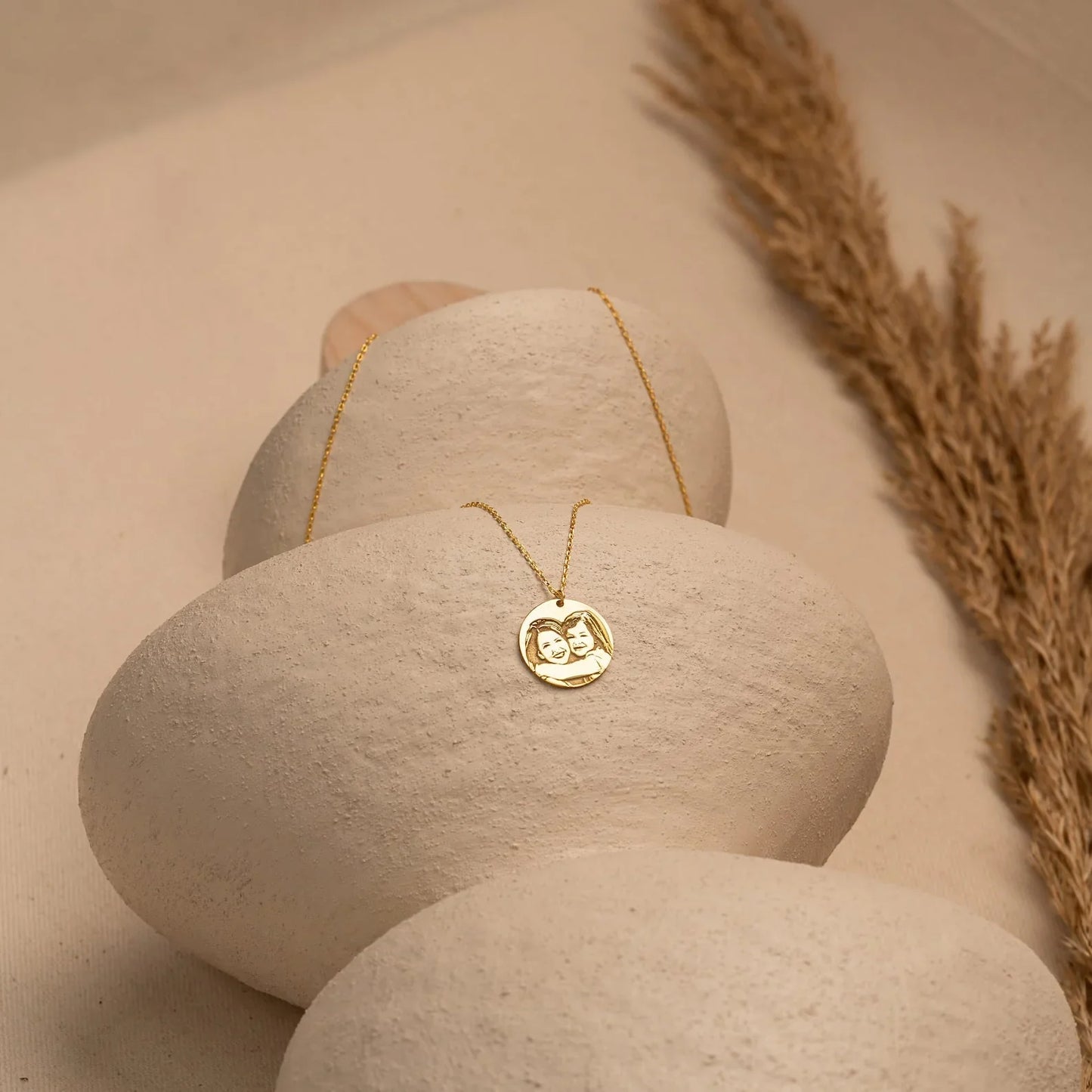 Eraya Jewel Personalized Photo Memorial Pendant resting gently on a surface, perhaps with a meaningful item in the background, evoking remembrance and sentiment