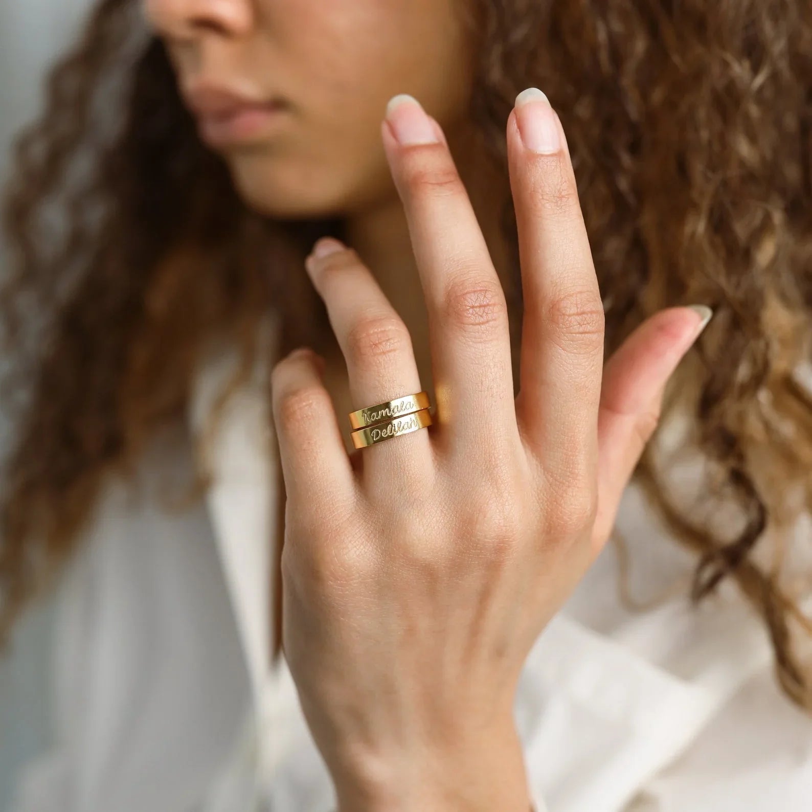 Model's hand displaying elegant Eraya Jewel Personalized Name Engraved Ring.