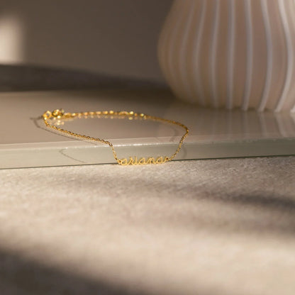 Product image of the Eraya Jewel Custom Delicate Name Bracelet in polished Gold, detailing the fine chain and customizable nameplate designed for girls.