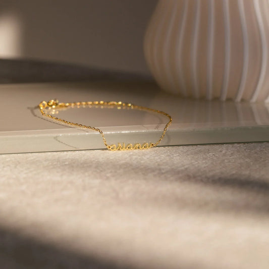 Product image of the Eraya Jewel Custom Delicate Name Bracelet in polished Gold, detailing the fine chain and customizable nameplate designed for girls.