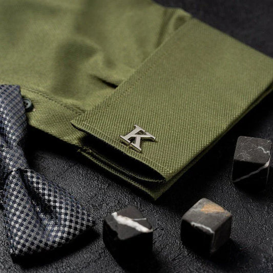 Man wearing Eraya Jewel Customized Single Initial Cufflinks in Silver, showcasing a personalized bold letter on his shirt cuff.