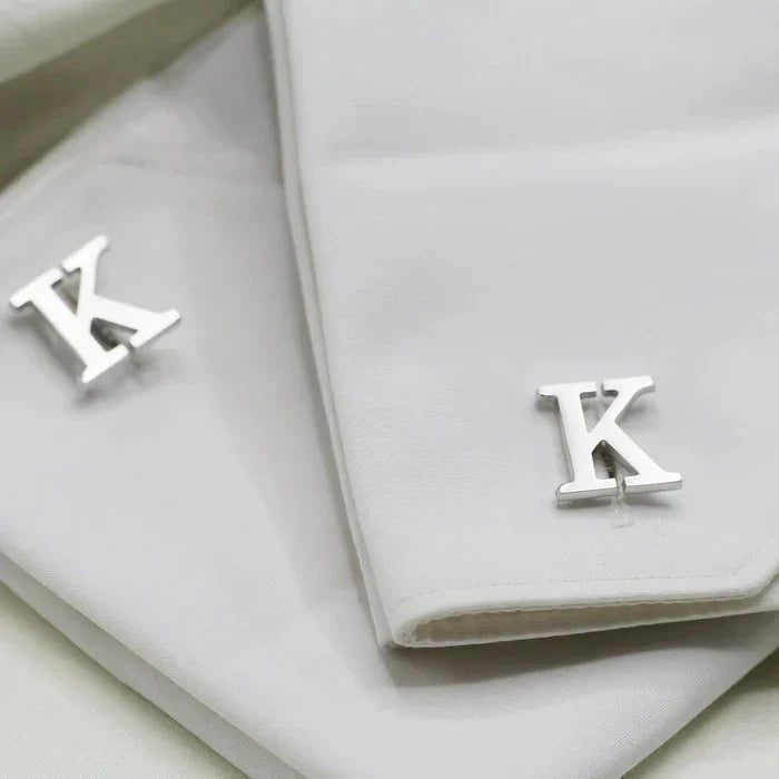 Close-up of an Eraya Jewel Silver Customized Single Initial Cufflink on a man's shirt, highlighting the elegant personalized initial detail.
