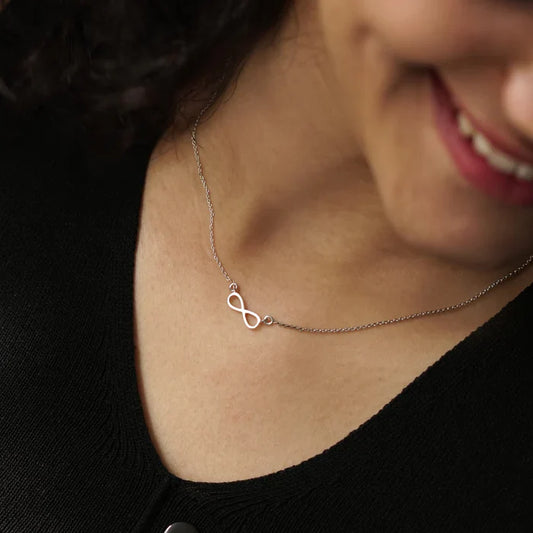 Model wearing the Eraya Jewel 925 Sterling Silver Infinity Necklace, showcasing its elegant drape and everyday style