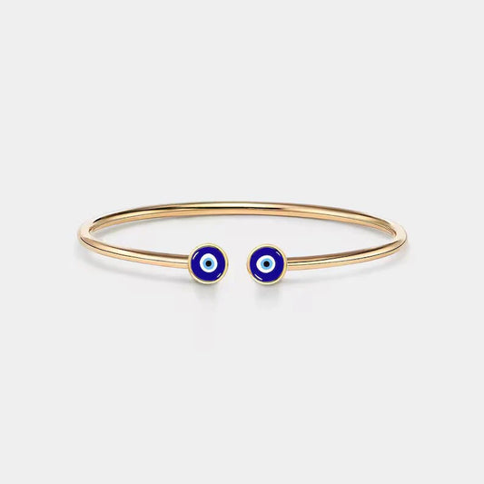 Close-up of the Eraya Jewel Evil Eye Nazar Bracelet in gold plated finish, showcasing the vibrant blue evil eye charm