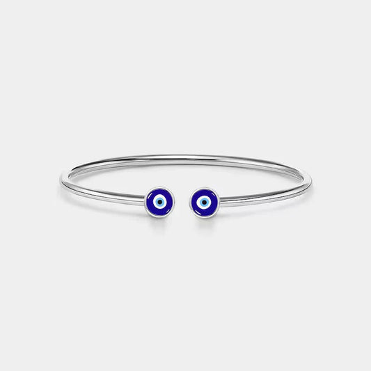 Eraya Jewel Evil Eye Nazar Bracelet in silver plated, highlighting the sleek and modern design of the bracelet featuring the protective Nazar or evil eye symbol.