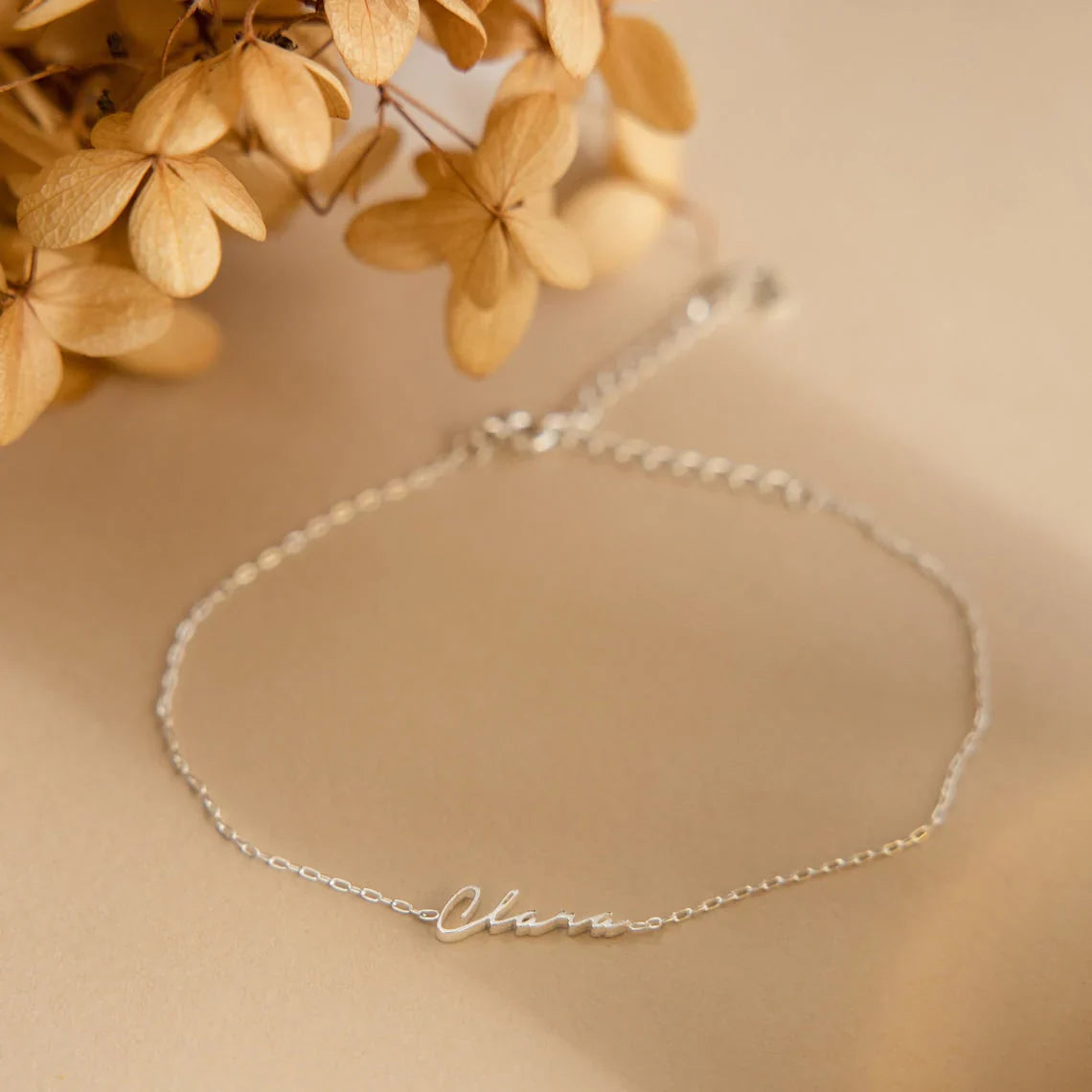 Product image of the Eraya Jewel Dainty Name Bracelet in polished Silver, featuring its fine chain and custom name option.