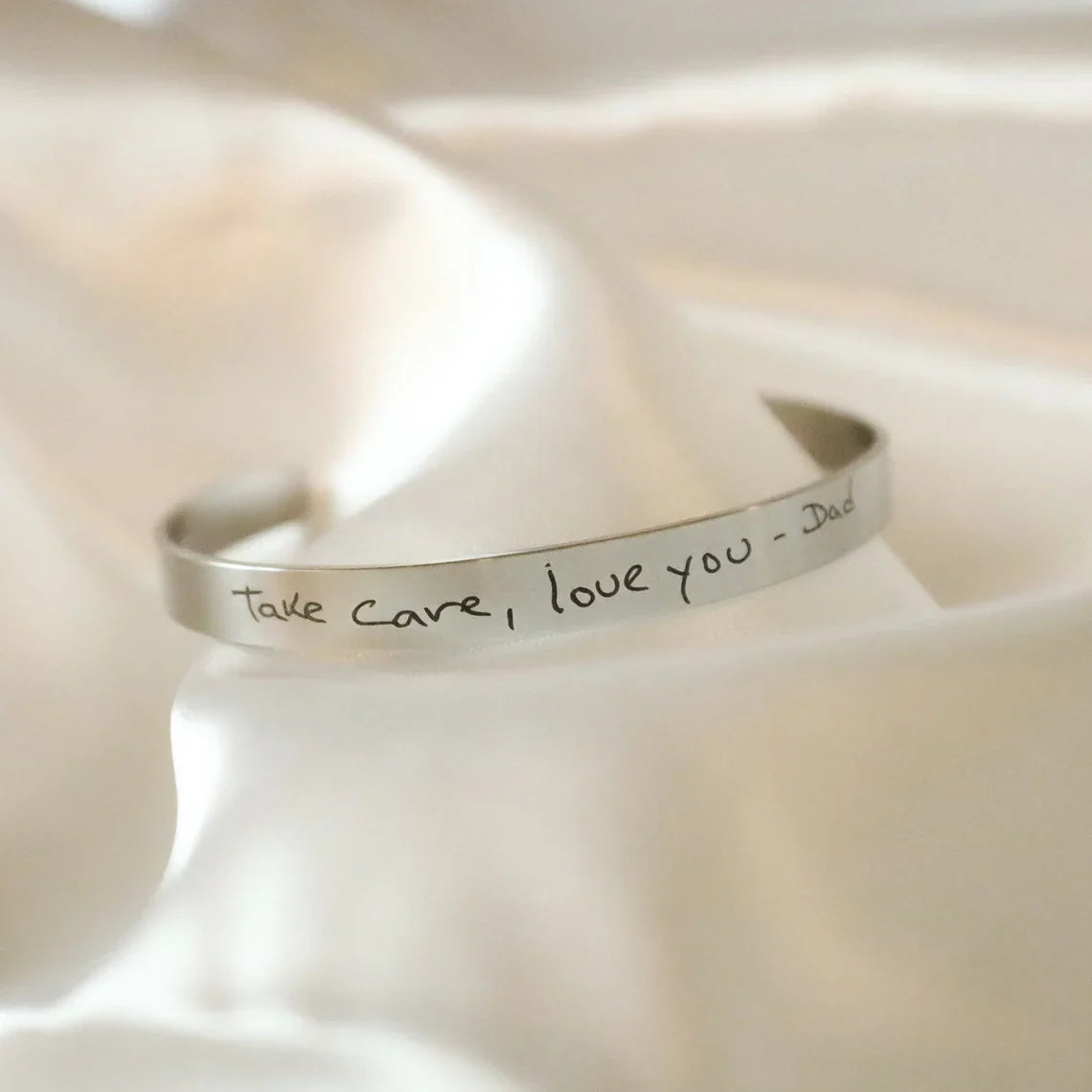 Product image of an Eraya Jewel 'Real Handwriting' Cuff Bracelet in polished Silver, showcasing the personalized actual handwriting feature