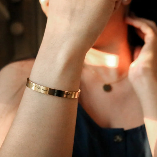 Model showcasing an Eraya Jewel 'Real Handwriting' Cuff Bracelet in Gold, with a custom signature elegantly displayed on her wrist.