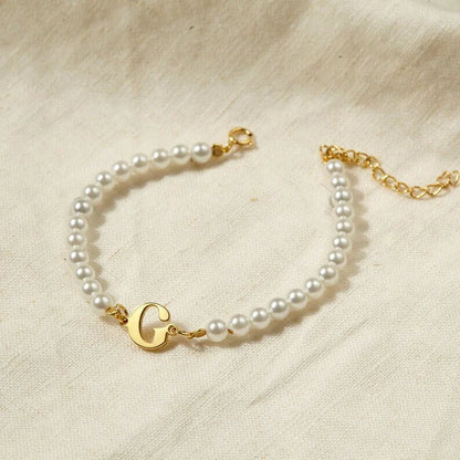 Your Initial Letter Pearl Bracelet' with Gold Polish finish displayed on a white background.