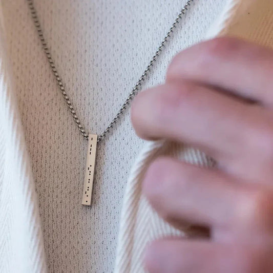 Close-up of the Custom Men's Morse Code Bar Pendant in a gold-polished finish, showcasing sleek design and personalized Morse code engraving.