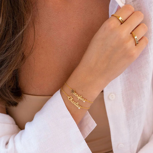 Close-up of the Eraya Jewel Gold Polish Cursive Name Bracelet showing script detail