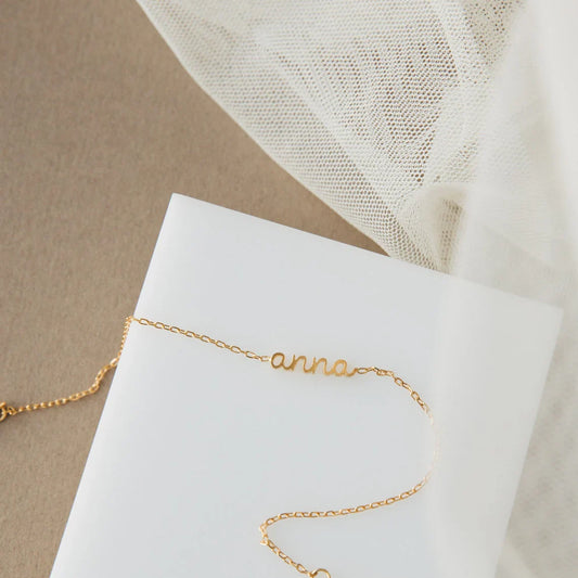 Product image of the Eraya Jewel Dainty Layering Name Bracelet in polished Silver, featuring its delicate chain and custom name option.
