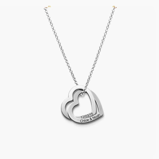 Close-up view of the Twin Heart Engraved Name Necklace in silver polished finish, showcasing delicate dual heart engravings