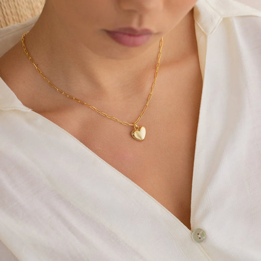 Model wearing the Paperclip Heart Pendant, highlighting its modern, minimalist design and romantic detail.