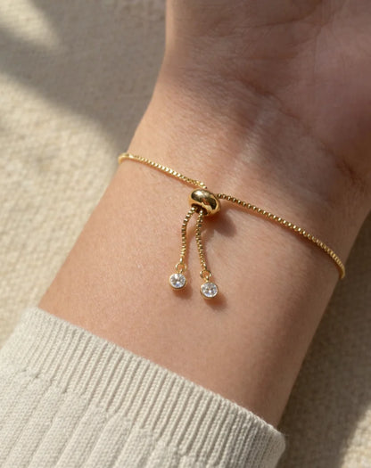 adjustable sliding closure bracelet with gold chain detail