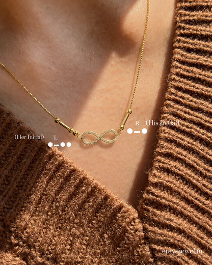 Eraya Infinity Initial Morse Code Necklace with personalized initials and infinity symbol, meaningful couple necklace in gold and rhodium finish.