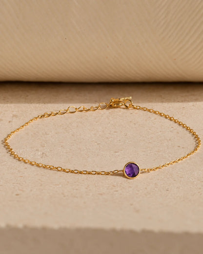 Eraya Jewel dainty birthstone bracelet featuring a purple February birthstone in 22K gold finish