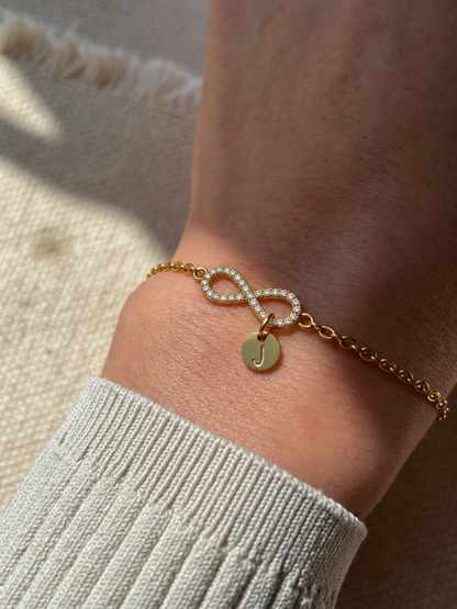 Eraya Jewel gold personalized pavé infinity bracelet with initial coin and zircon stones