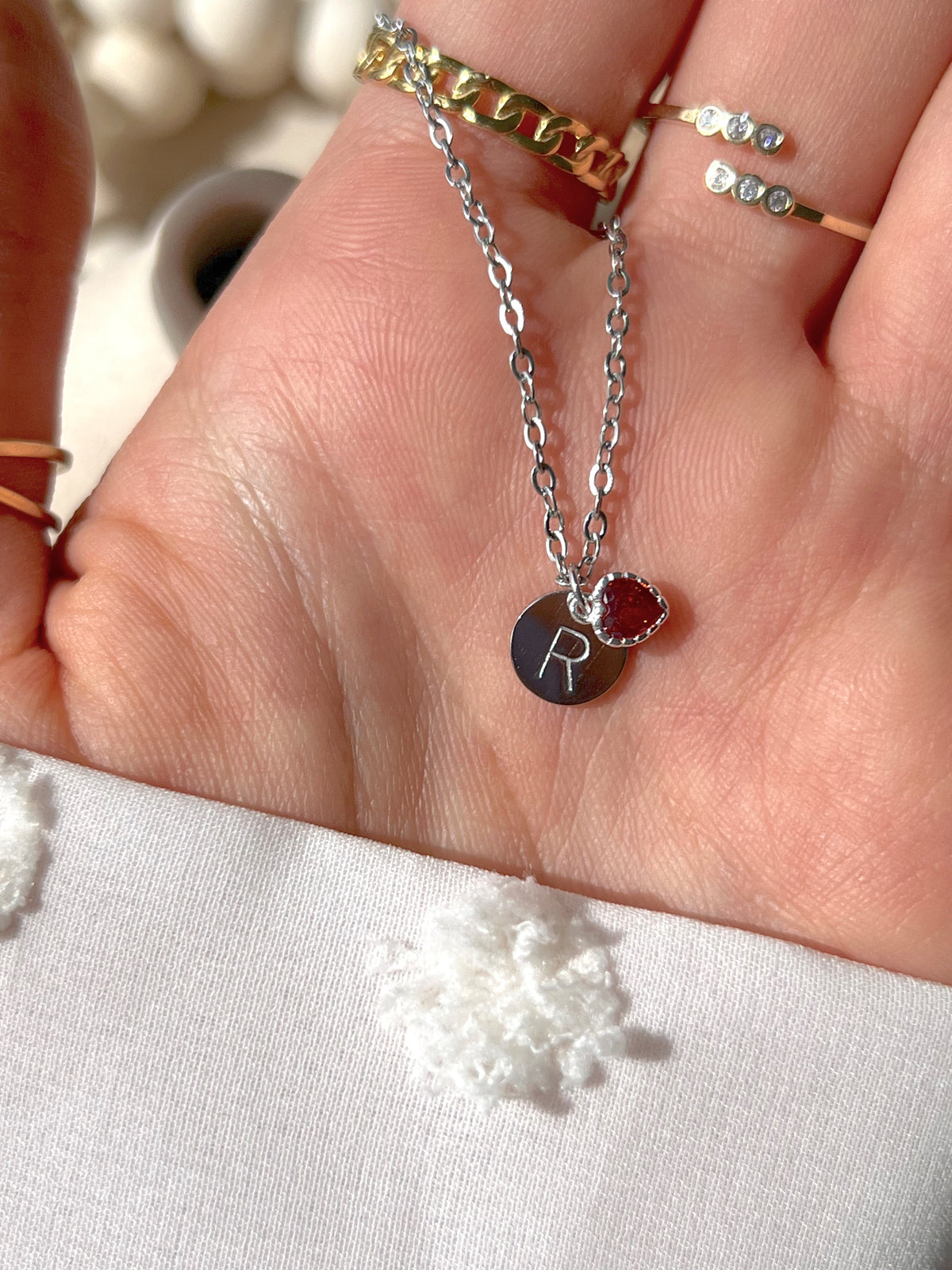 Eraya Jewel Secret Initial Heart Pendant showing a personalized initial hidden behind the heart charm