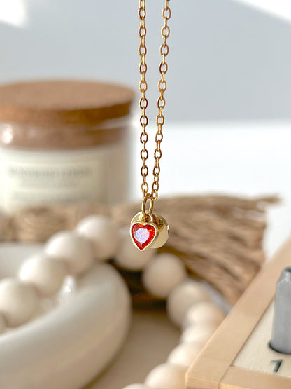 Eraya Jewel Secret Initial Necklace with a red heart charm and personalized hidden initial
