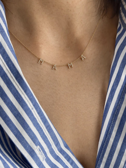 Eraya Pavé MAMA Necklace in 22K gold finish on model, minimalist necklace inspired by the trending celebrity MAMA necklace, meaningful gift for moms and new moms.