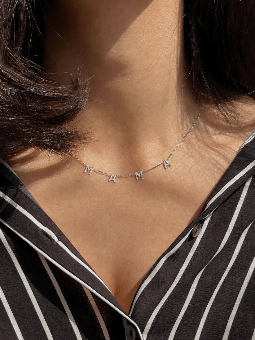 Eraya Pavé MAMA Necklace in rhodium finish on model, minimalist MAMA necklace for everyday wear, premium gift for mom, new mom and motherhood jewelry.