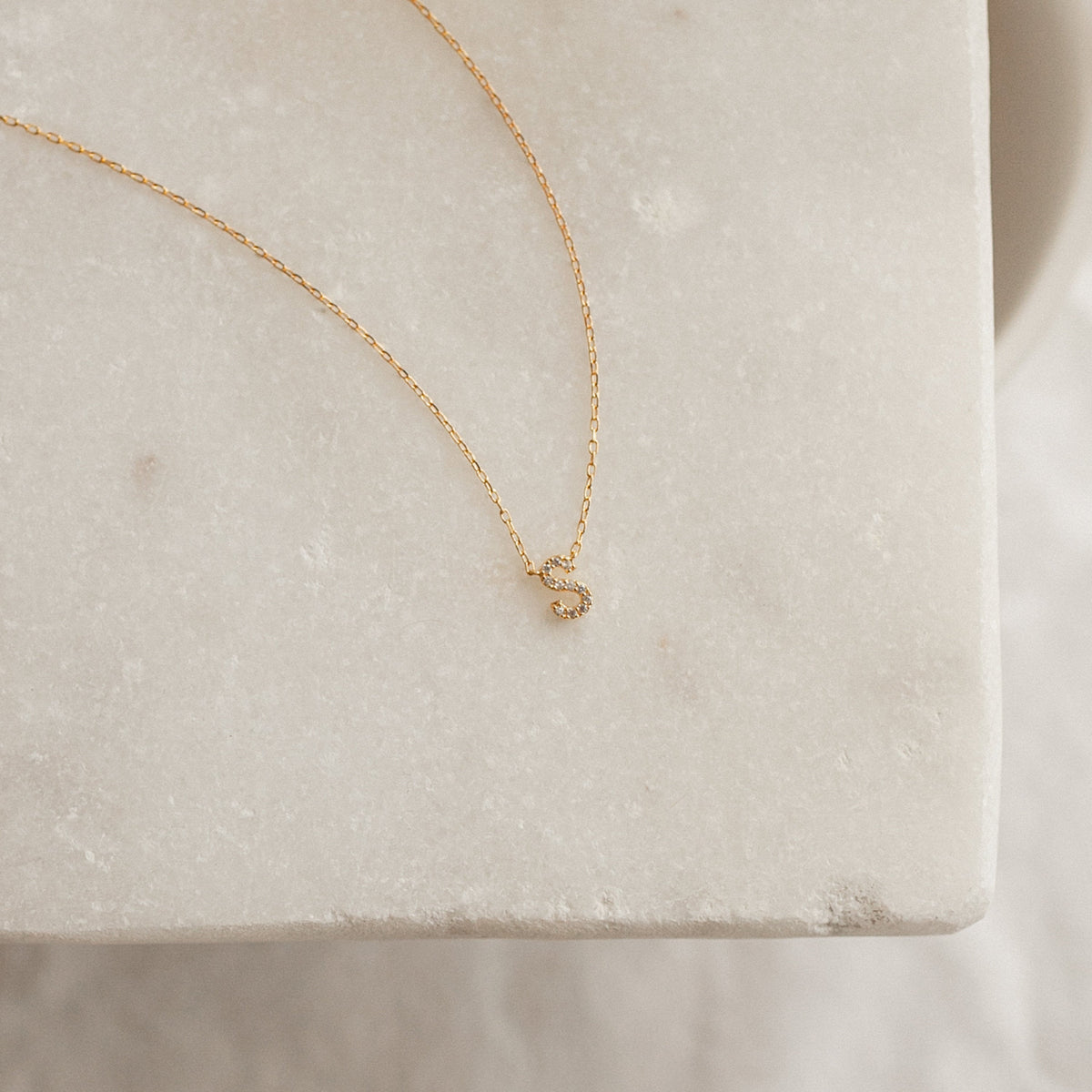 Personalized Letter Necklace with a 7mm pavé CZ letter S in 22K Gold Finish.
