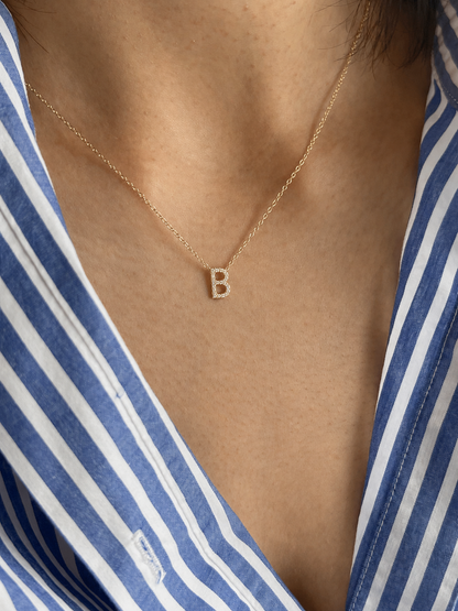 Model wearing a Personalized Diamond Initial Necklace with a 7mm pavé CZ letter B in 22K Gold Finish.