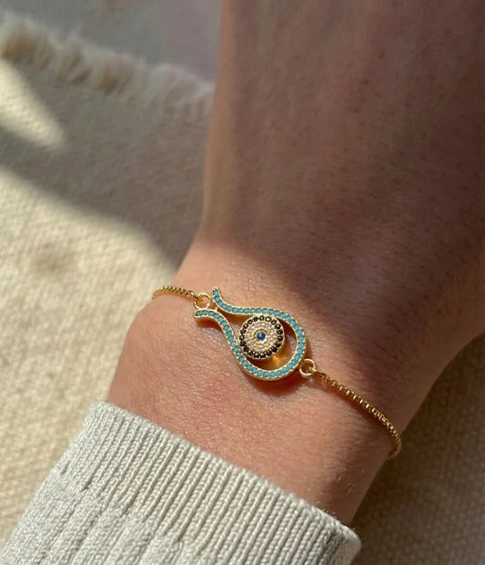 kairi evil eye bracelet in 18k gold finish with blue stones minimal nazar bracelet