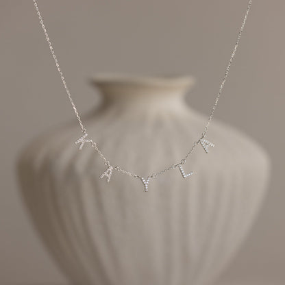 Personalized Pavé Letter Name Necklace in 22K gold finish featuring custom CZ pavé letters with a minimal everyday design by Eraya Jewel.