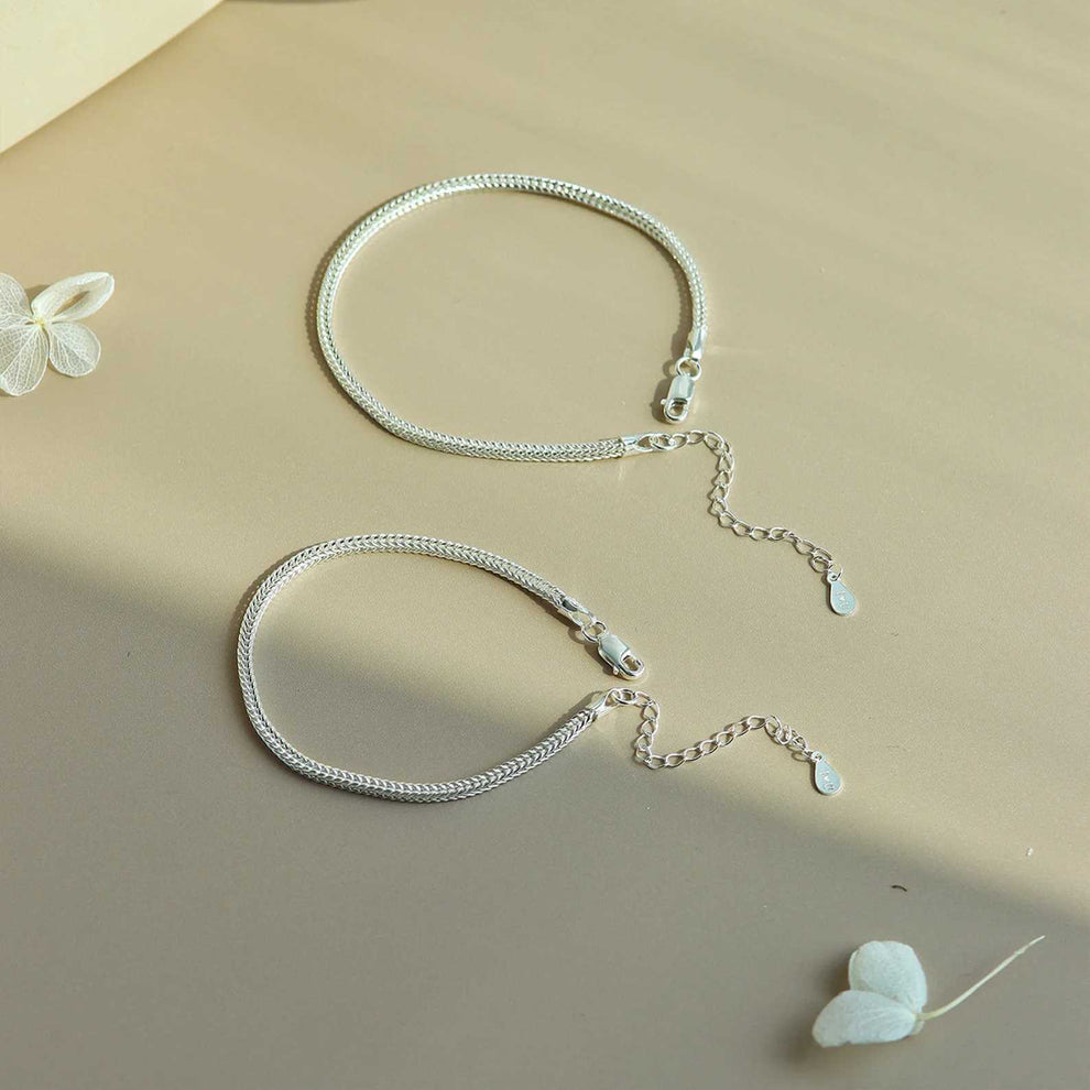 Close-up of Forever Us 925 silver bracelet pair on display for product shoot