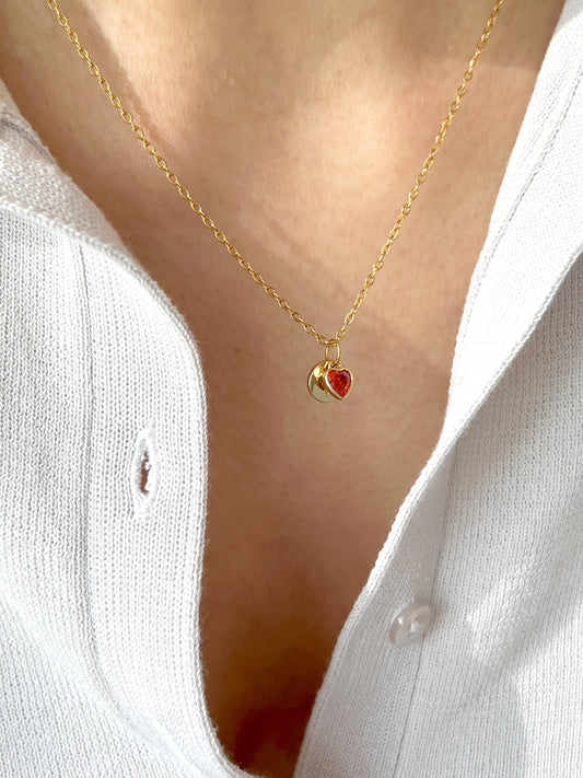 Model wearing gold polished initial pendant necklace with hidden engraving, styled for a minimal everyday look