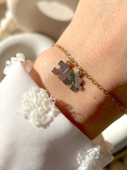 Model wearing silver you complete me bracelet with silver initials 
