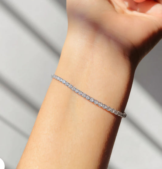 925 sterling silver tennis bracelet with sparkling cubic zirconia stones on a white background