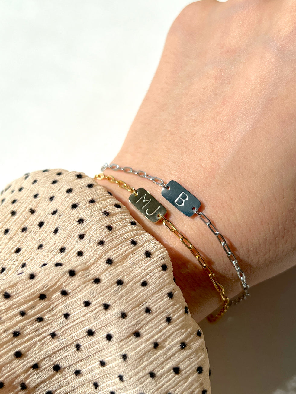 Women wearing gold and silver both bracelet 