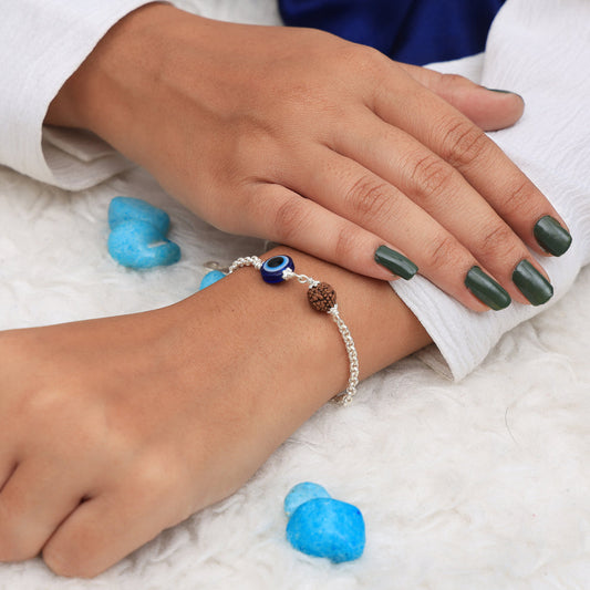 Model wearing Rudraksha evil eye 925 silver bracelet on wrist, showcasing a stylish and spiritual accessory for daily wear.
