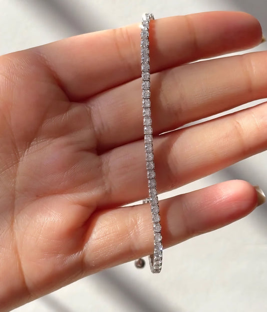 Elegant 925 silver bracelet worn on a woman’s wrist, showcasing its minimalist and luxurious design.