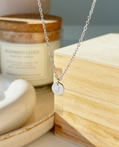 Product shoot of silver initial coin 