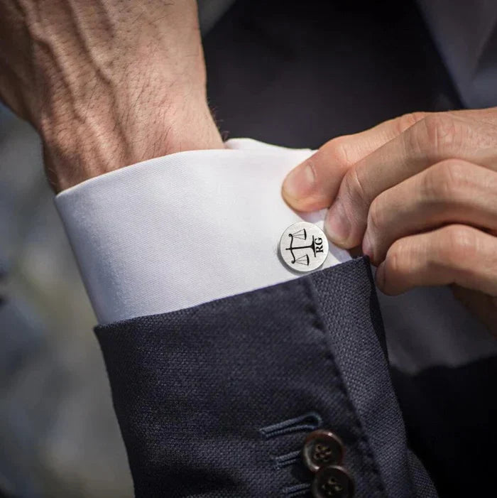 Man wearing Eraya Jewel Custom Lawyer Cufflinks, featuring a personalized legal-themed design, adding a professional touch to his shirt cuff.