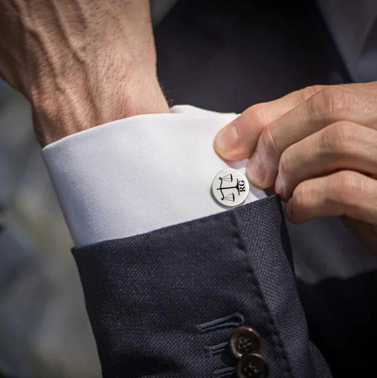 Man wearing Eraya Jewel Custom Lawyer Cufflinks, featuring a personalized legal-themed design, adding a professional touch to his shirt cuff.