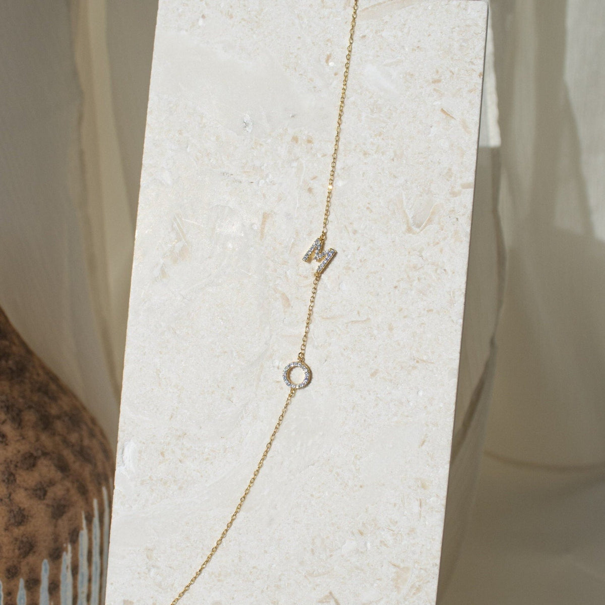Sideways pavé couple initial necklace with sparkling CZ M and O initials